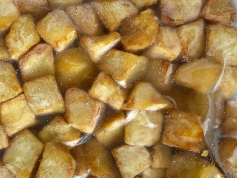 Frozen fried sweet potato dice in a clear bag