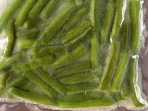 Frozen seasoned cut green beans in a vacuum-sealed bag