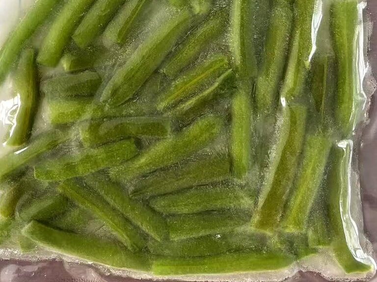Frozen seasoned cut green beans in a vacuum-sealed bag