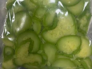 Frozen seasoned zucchini slices in a vacuum-sealed bag