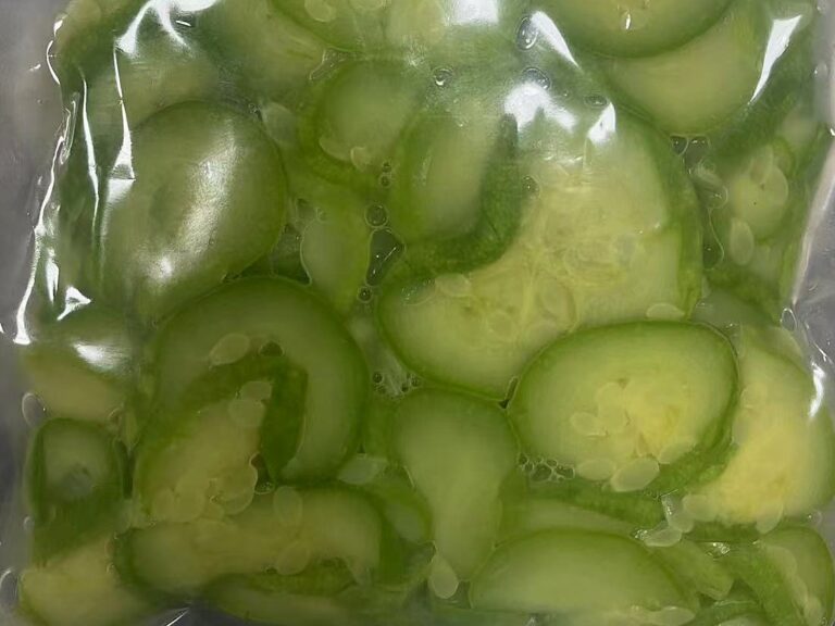Frozen seasoned zucchini slices in a vacuum-sealed bag