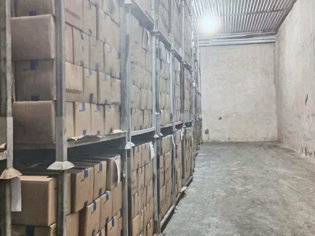Cartons of finished product stored on racks in a cold store
