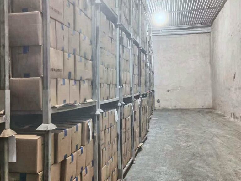Cartons of finished product stored on racks in a cold store