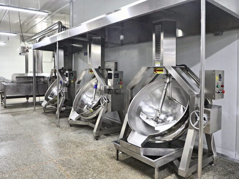 Jacketed cooking kettles under an extraction hood